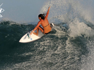 Girl Surfer off the lip, Mag Bay Mexico
