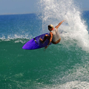 Girl Surfer big off the lip, Mag Bay Mexico