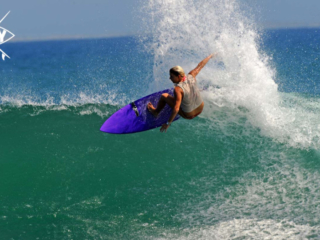 Girl Surfer big off the lip, Mag Bay Mexico