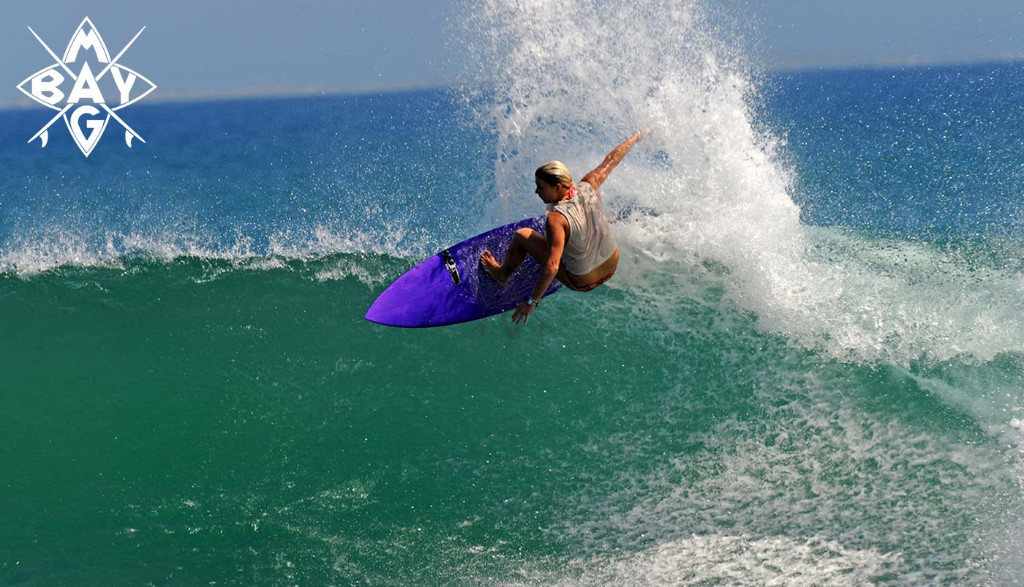 Girl Surfer big off the lip, Mag Bay Mexico