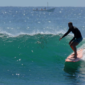 Longboard with boat in background, Mag Bay Mexico