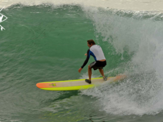 Longboarder on a big wave, Mag Bay Mexico