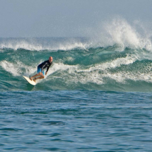 Surfer cut back at Cuevas, Mag Bay mexico