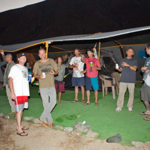 Men talking and drinking cocktails and beer, Mag Bay mexico